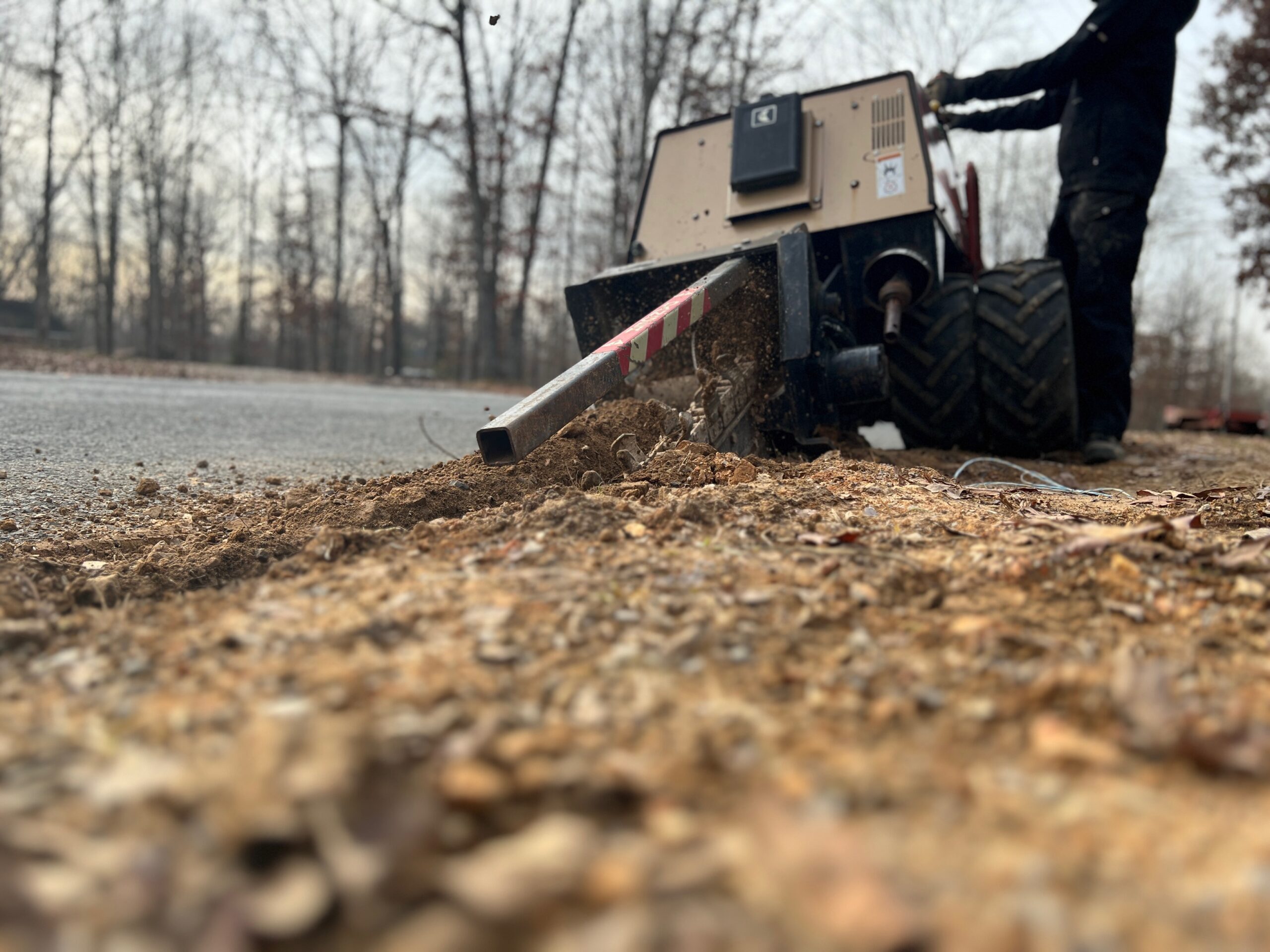 Trenching equipment installing underground conduit